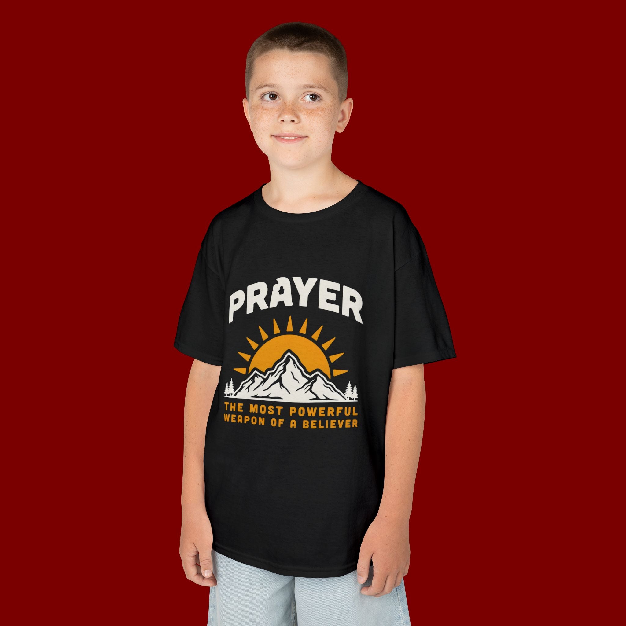 Kids Tee — "Prayer: The Most Powerful Weapon of a Believer" Mountain Sun Graphic