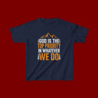 Kids Tee - "God Is the Top Priority in Whatever We Do" Faith Mountain Graphic