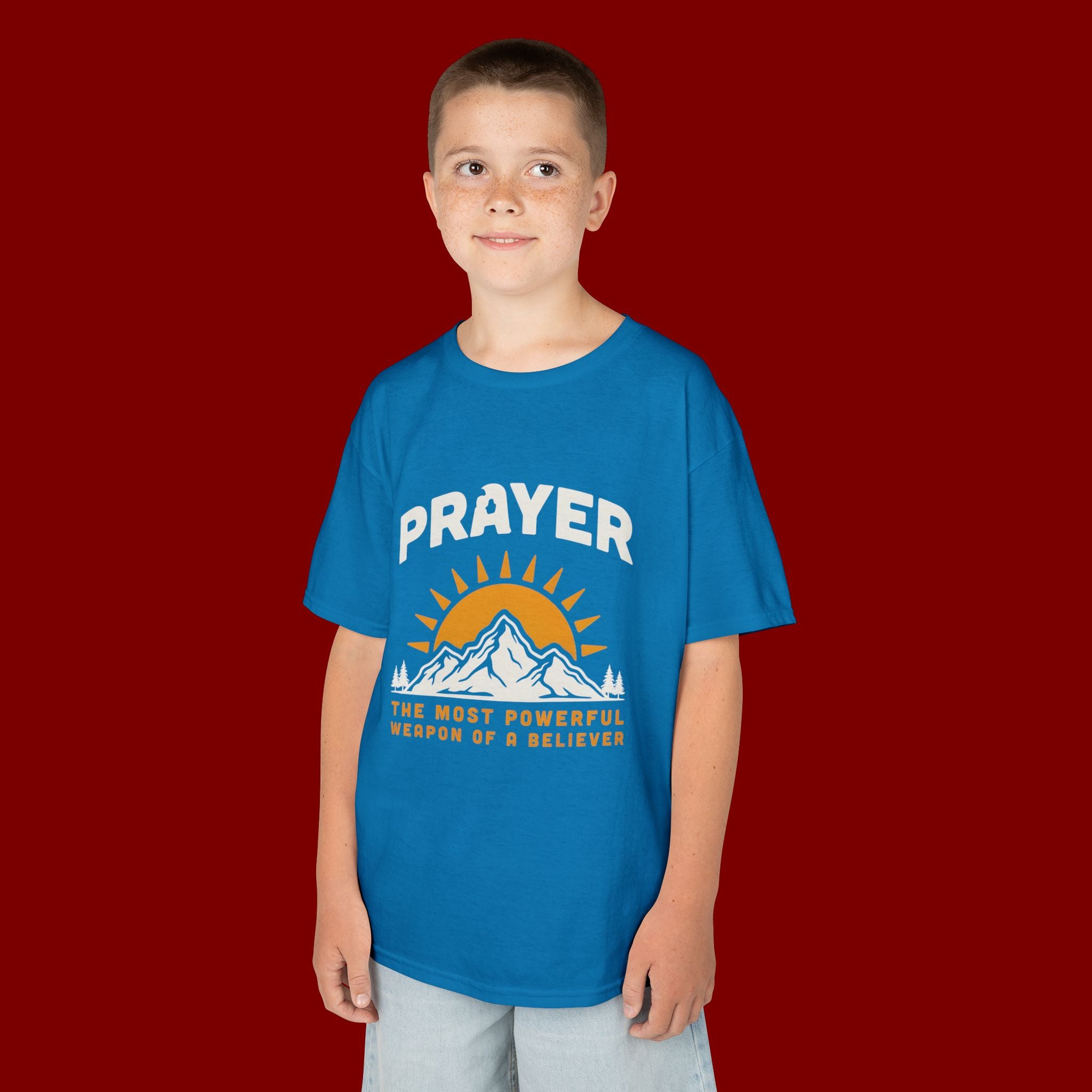 Kids Tee — "Prayer: The Most Powerful Weapon of a Believer" Mountain Sun Graphic