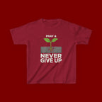Kids Tee – "Pray & Never Give Up" Inspirational Plant Graphic