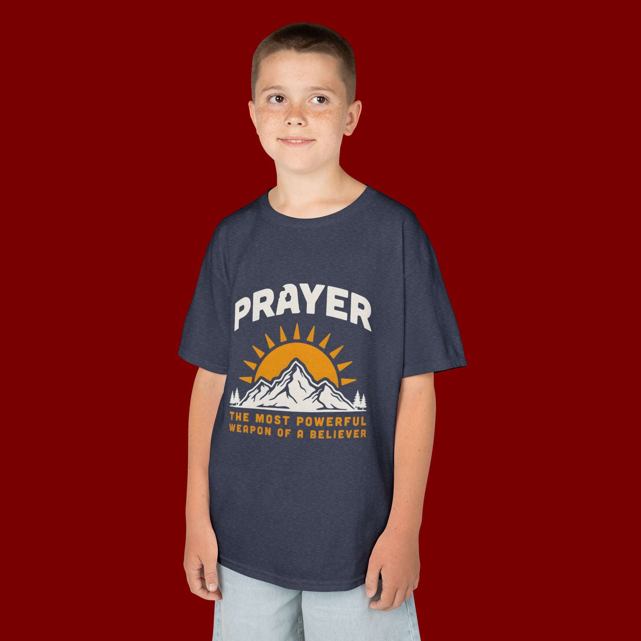 Kids Tee — "Prayer: The Most Powerful Weapon of a Believer" Mountain Sun Graphic
